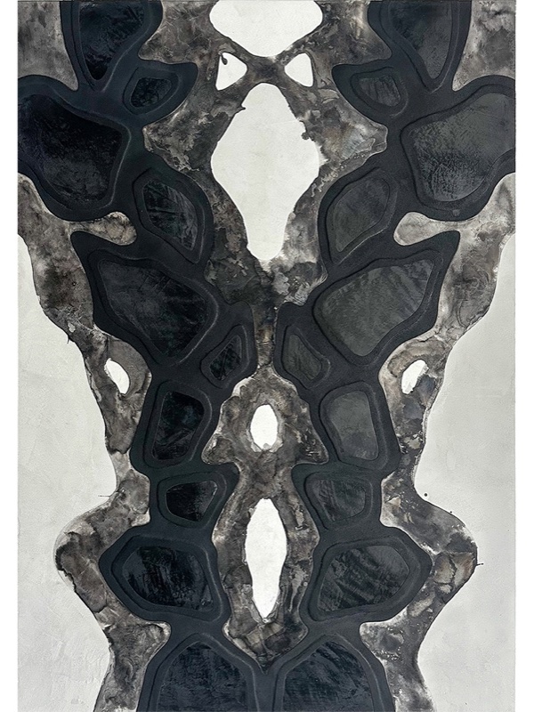 A tall vertical relief panel displaying a symmetric organic vein pattern resembling a butterfly or ribcage.