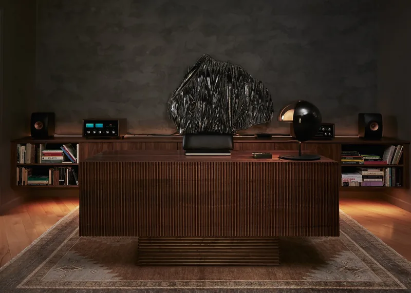 Study with dark mottled plaster wall and walnut desk, Tremont residence